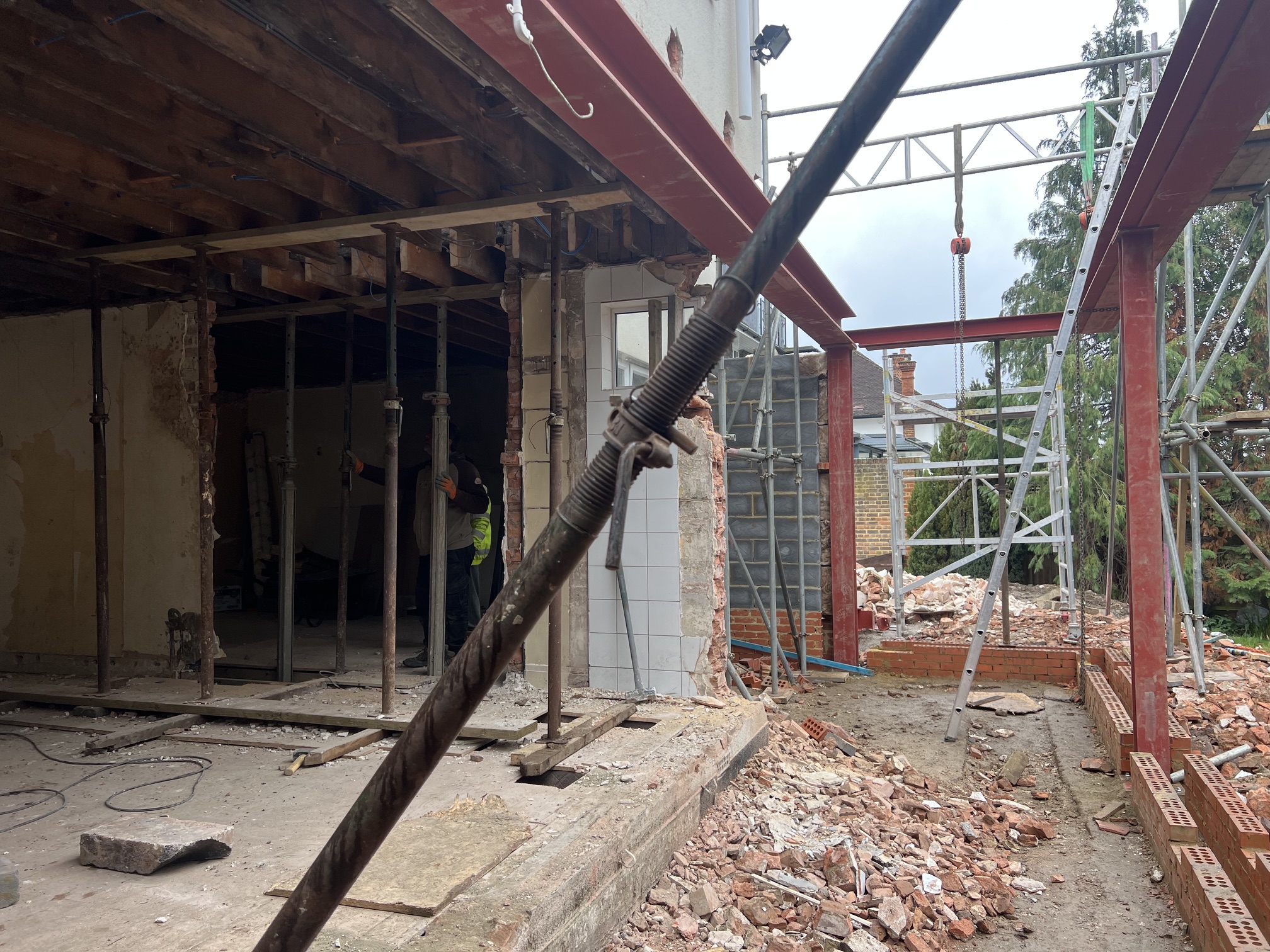 Rear extension steel frame under construction with scaffolding